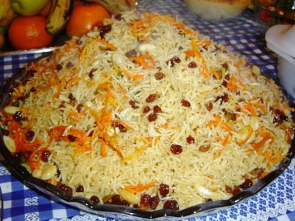 Kabuli palaw, widely regarded as the national dish of Afghanistan. The rice is steamed with lamb and topped with fried carrots and raisins, a centrepiece of feasts and family gatherings.