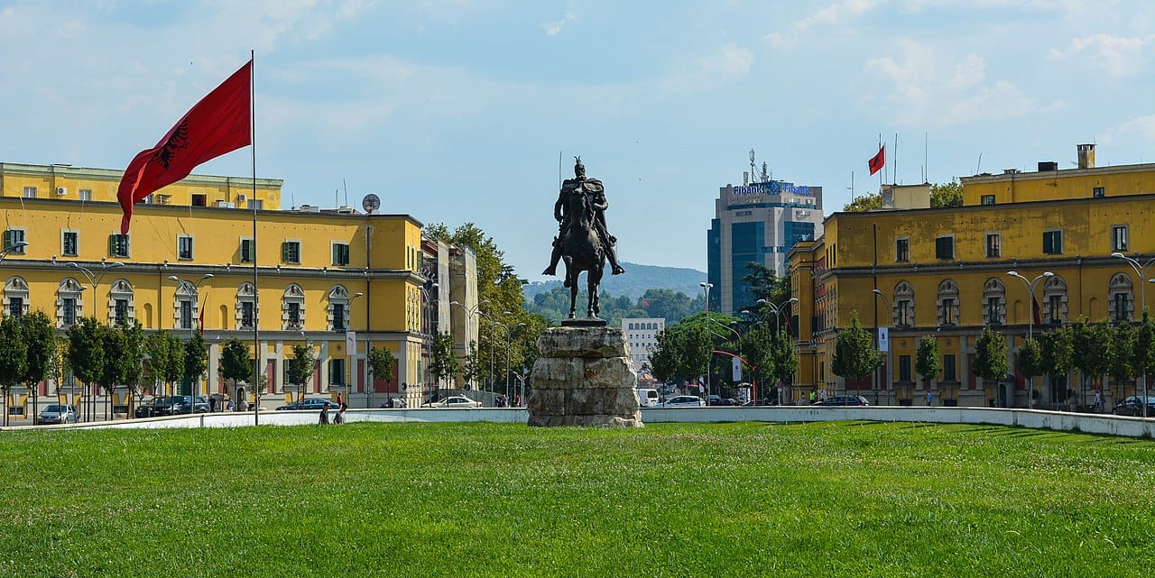 Skanderbeg Square at the heart of Tirana, the capital of Albania. Once a drab communist city, Tirana has been transformed in recent decades, its buildings famously painted in bright colours, into a lively Mediterranean capital.