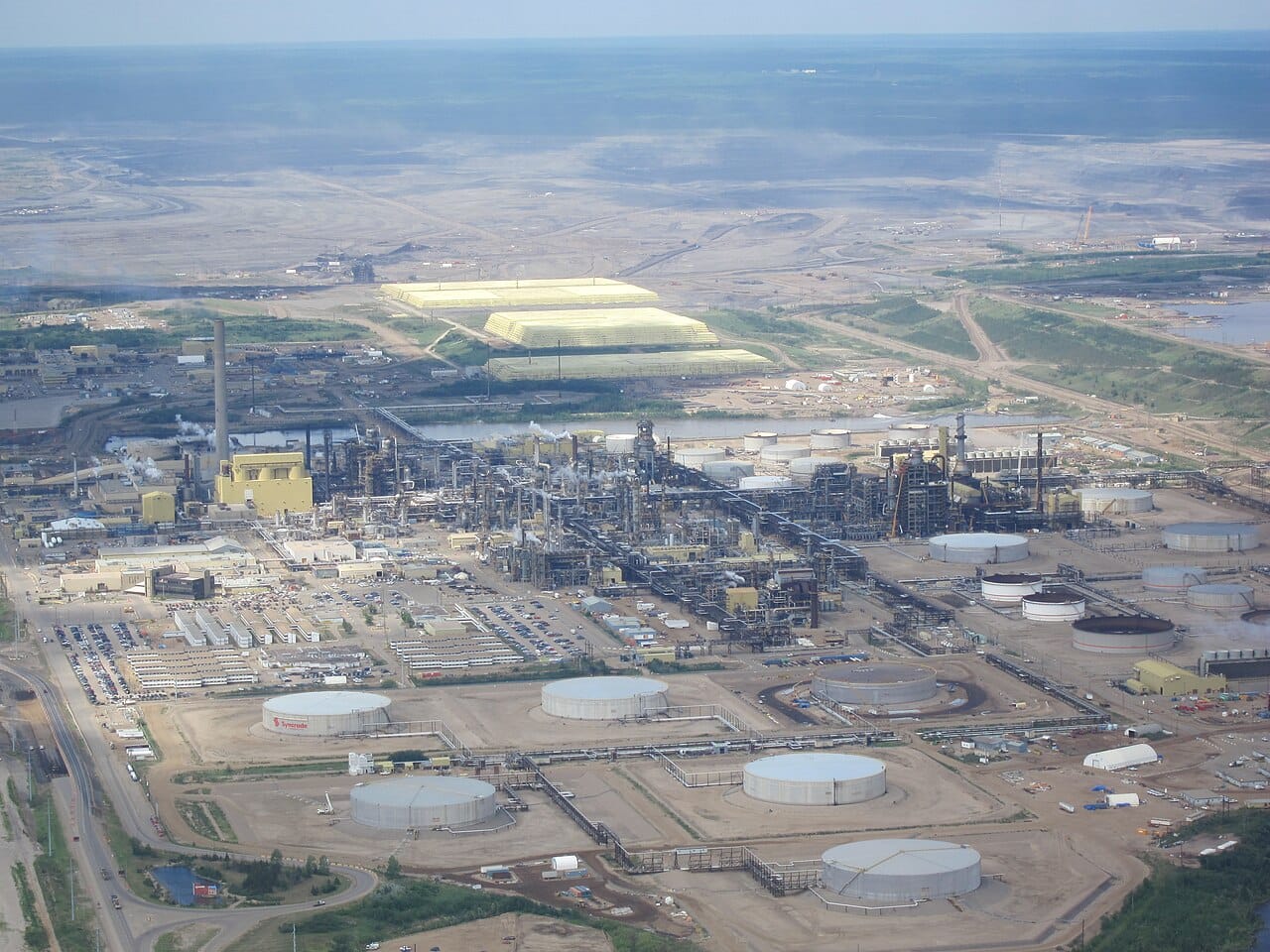 The minesite at Syncrude's Mildred Lake plant in the Athabasca oil sands of northern Alberta. The oil sands are among the largest petroleum deposits in the world and the foundation of the province's wealth.