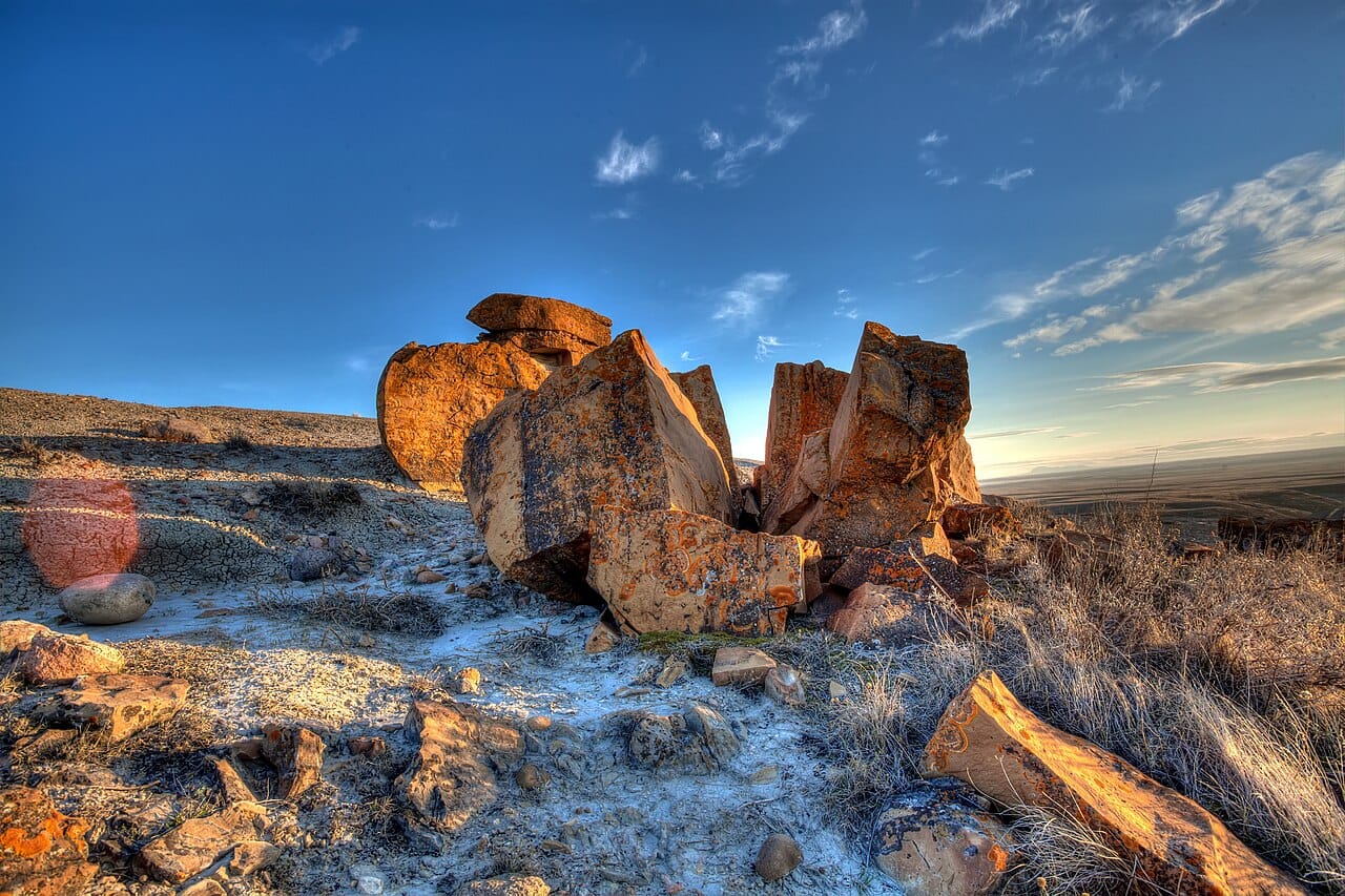 The eroded badlands of Red Rock Coulee in southern Alberta. Beyond the mountains the province opens into dry prairie and the strange, sculpted badlands where its dinosaur fossils are found.