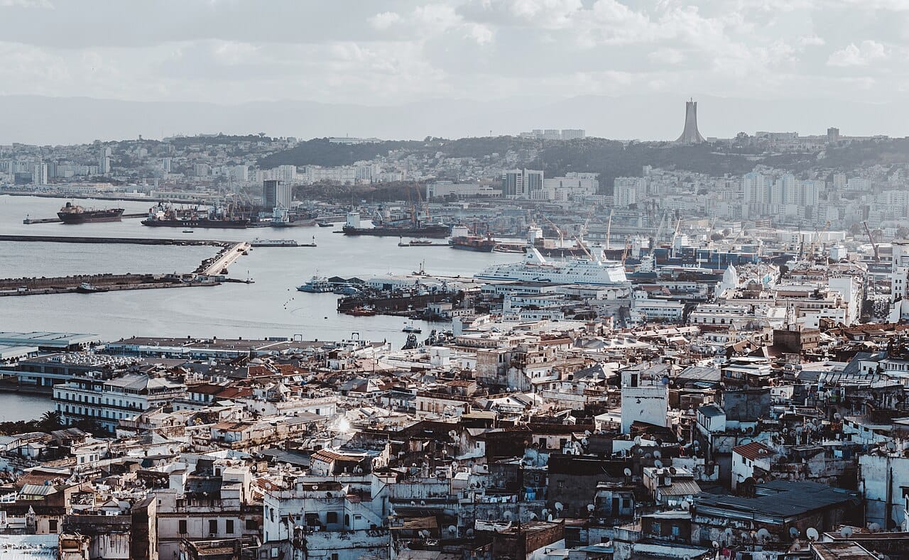 The bay of Algiers, the capital and largest city of Algeria, rising in tiers of white above the Mediterranean. The great majority of Algerians live along this northern coast, while the vast Saharan interior lies almost empty.