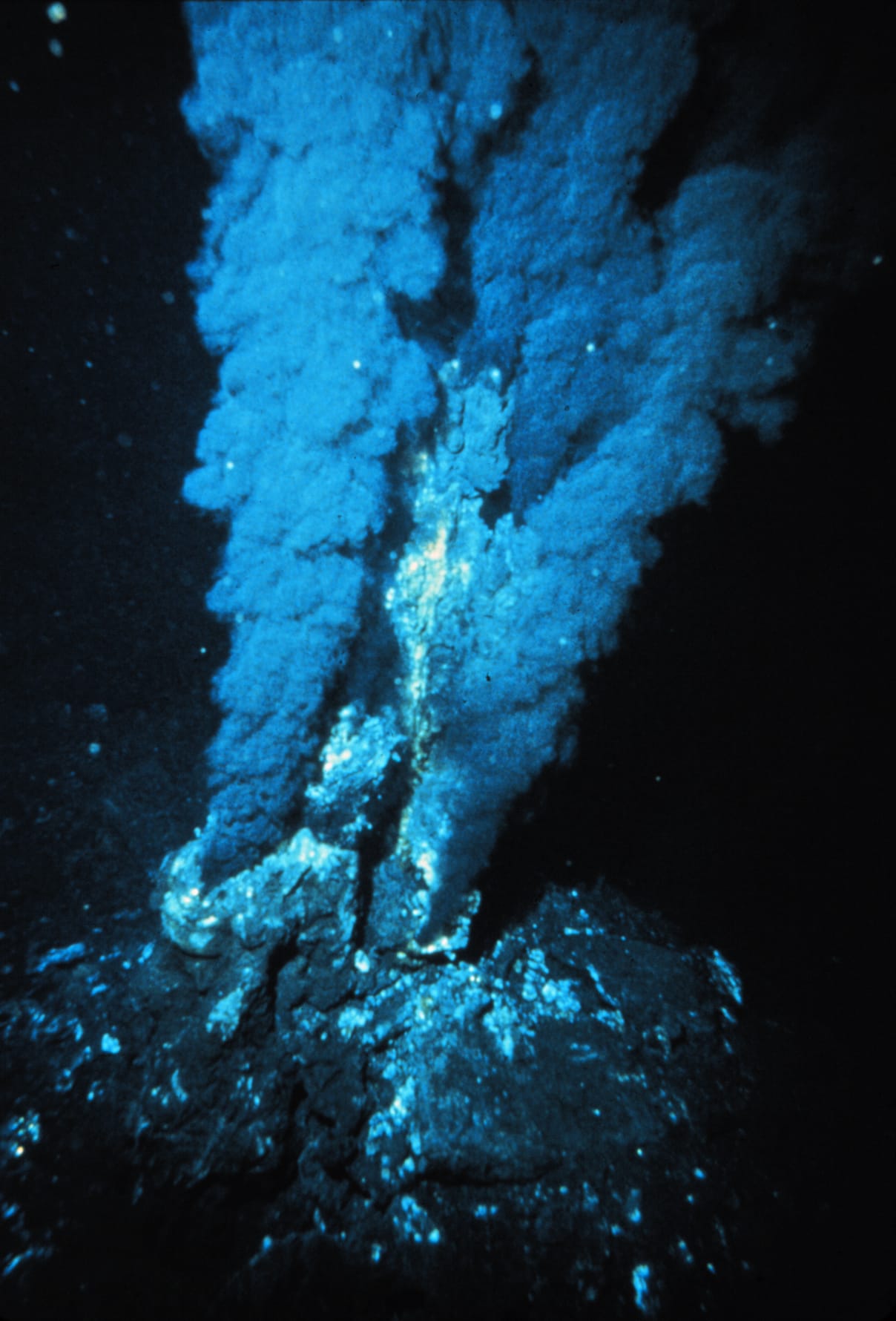 A black smoker. Volcanic vents of this kind are hot and acidic, and are a different environment from the alkaline vents the hypothesis concerns.