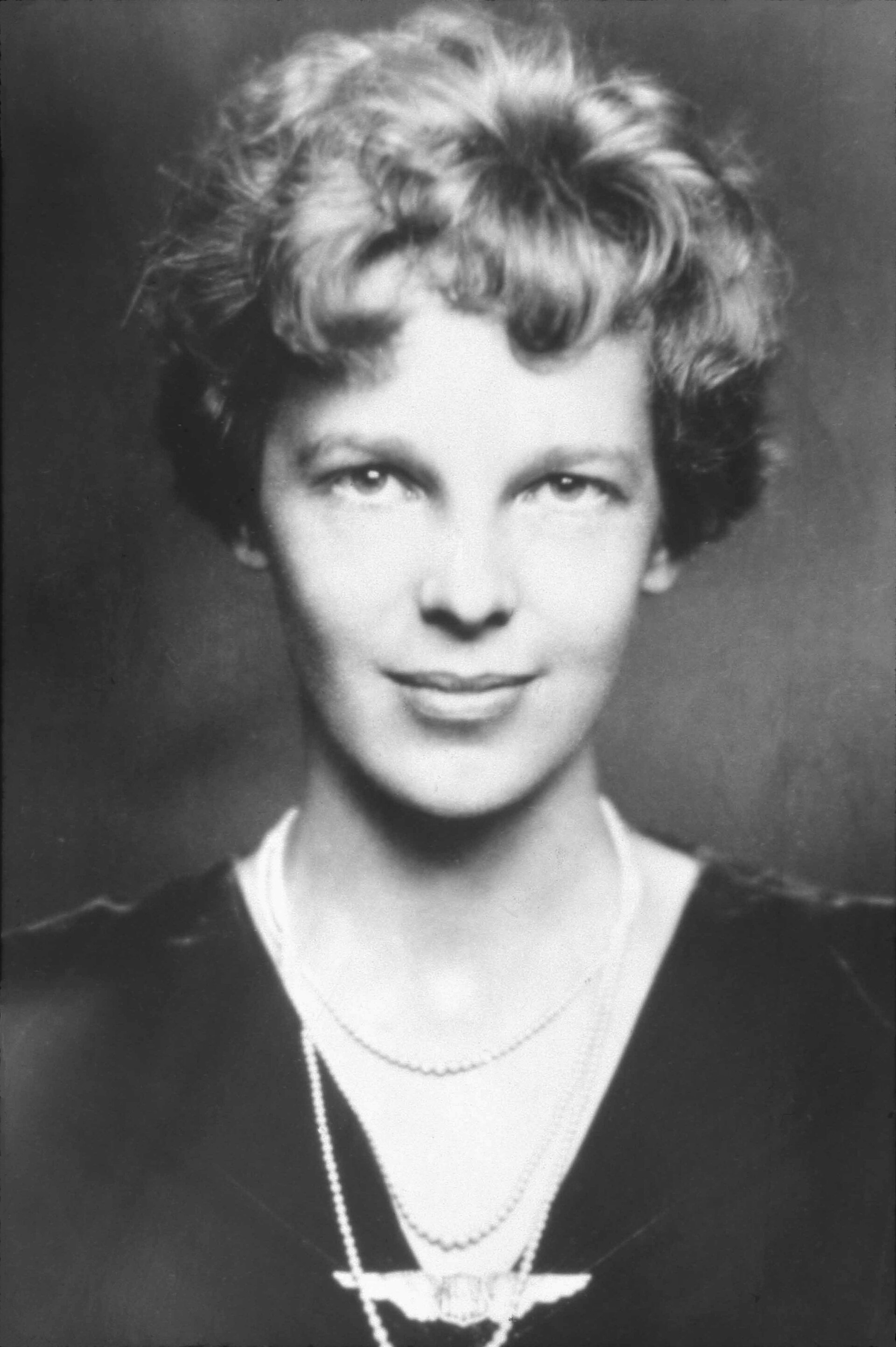 Earhart in evening dress; she was a celebrity as well as an aviator.