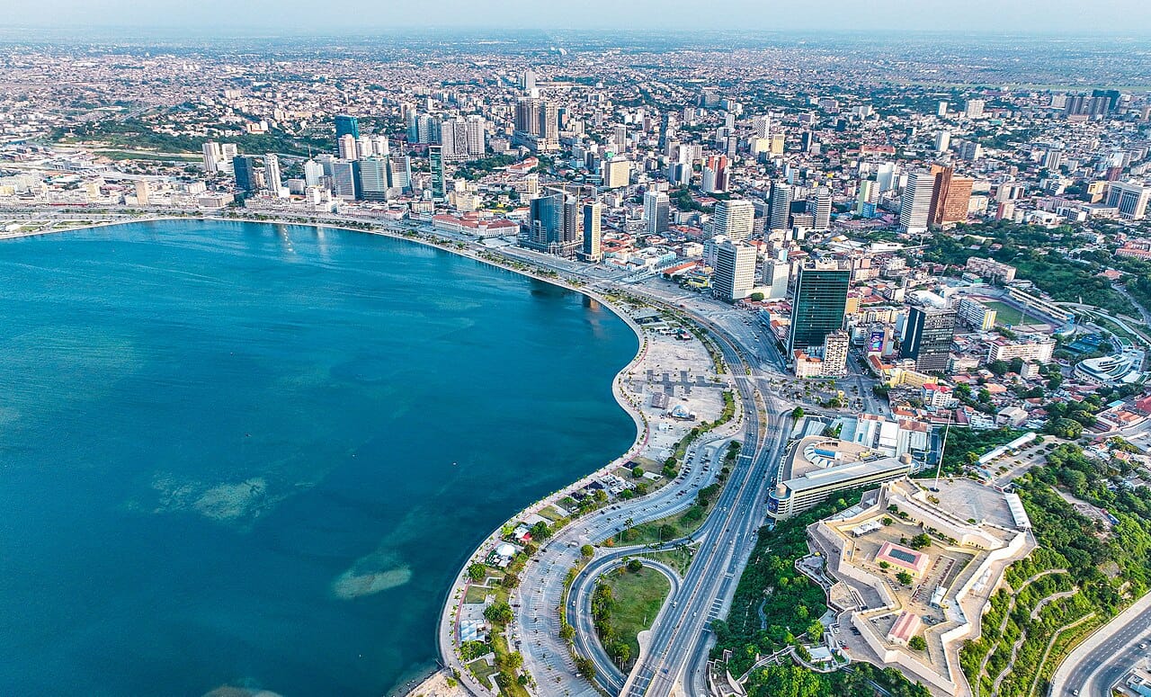 The skyline of Luanda, the capital of Angola, on the Atlantic. Swollen by oil wealth and by people fleeing the wars, it became one of the most expensive cities in the world, a place of gleaming towers rising above widespread poverty.