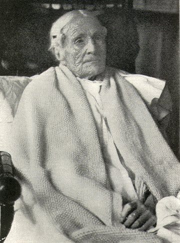 A woman photographed at 105. Selection acts weakly at ages most individuals never reach, which is why late-acting harm can be favoured.