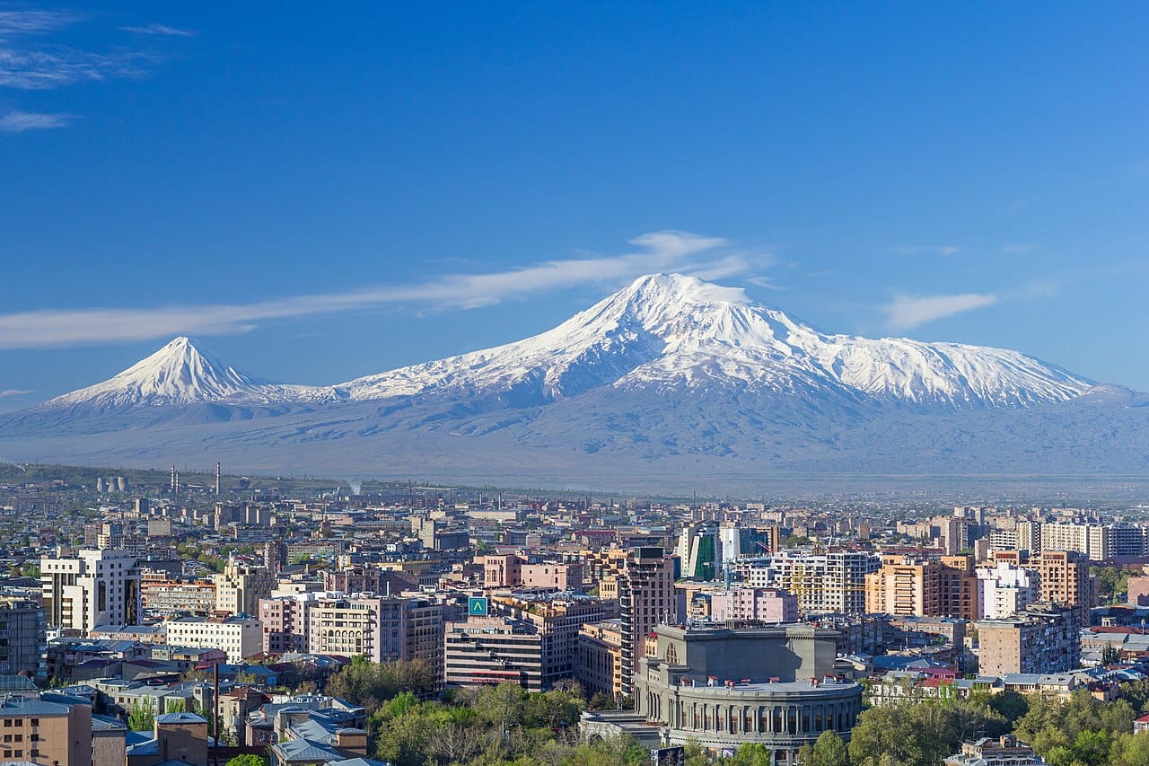 Mount Ararat rising beyond the skyline of Yerevan. Though the sacred peak now lies just across the closed border in Turkey, it dominates the horizon of the capital and remains the enduring emblem of the Armenian nation.