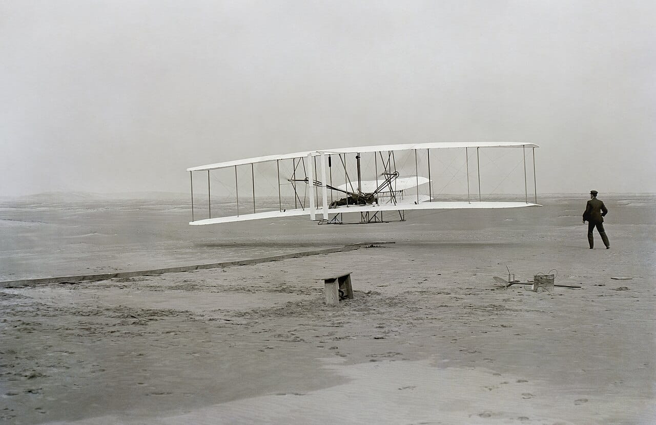 The Wright brothers' first powered flight, 1903. Their decisive contribution was three-axis control, without which sustained powered flight is not possible.