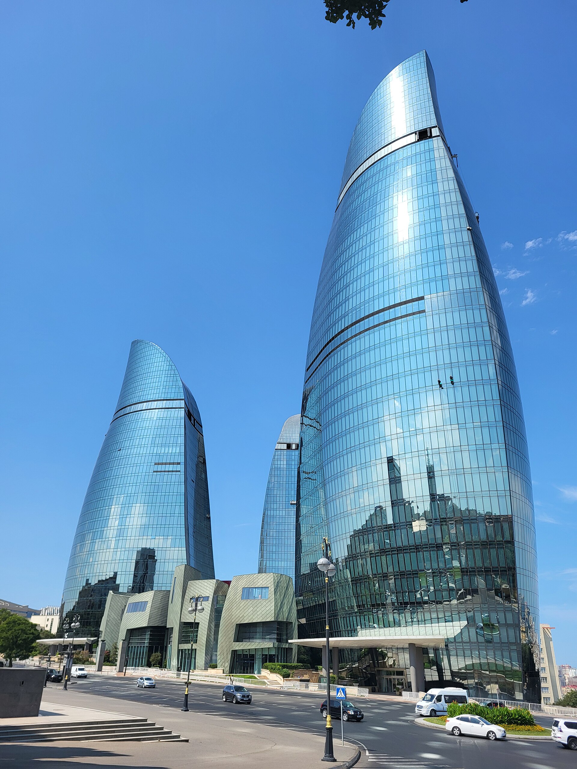 The Flame Towers rising over Baku, three curving skyscrapers lit to evoke the flames of the Land of Fire. Completed in 2012, they symbolise the transformation of the capital by oil and gas wealth.
