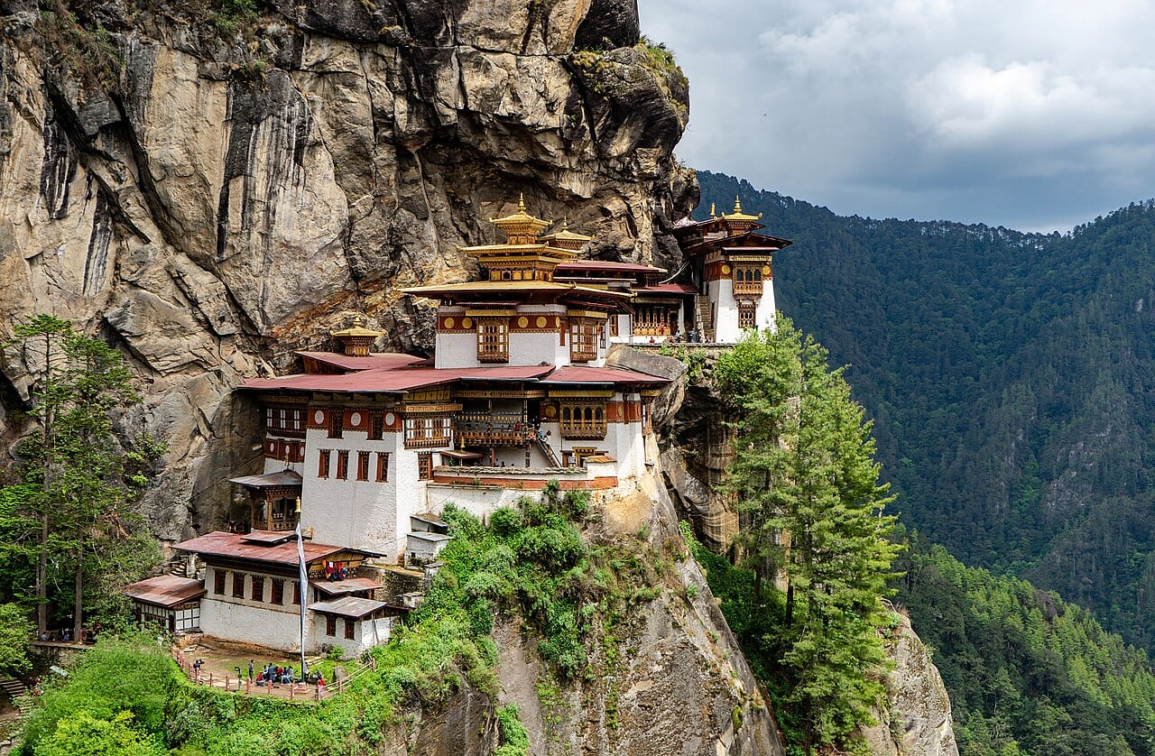 The Paro Taktsang monastery, the Tiger's Nest, clinging to a sheer cliff high above the Paro valley. It is the holiest site in Bhutan, built where the master Guru Rinpoche is said to have meditated.
