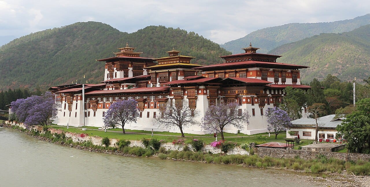 Punakha Dzong, built in the seventeenth century where two rivers meet. For centuries the winter capital of Bhutan, it is one of the grandest of the fortress-monasteries raised after the unification of the country.