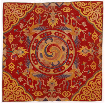 A Bhutanese religious textile of the kind used to cover sacred images and thrones. Fine weaving and Buddhist symbolism run through Bhutanese art, which serves faith as much as beauty.