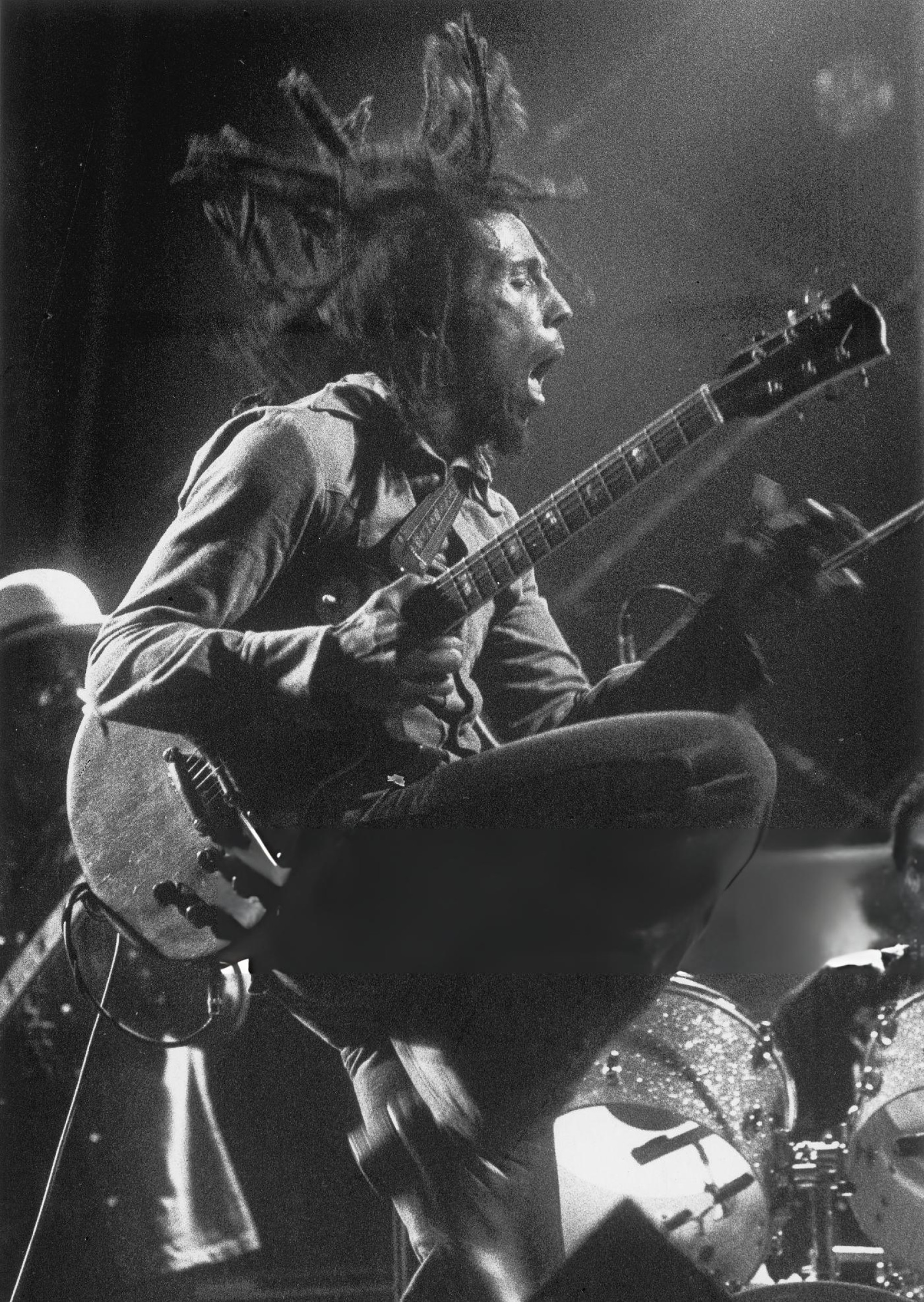 Bob Marley performing in 1975, spreading reggae across the globe.