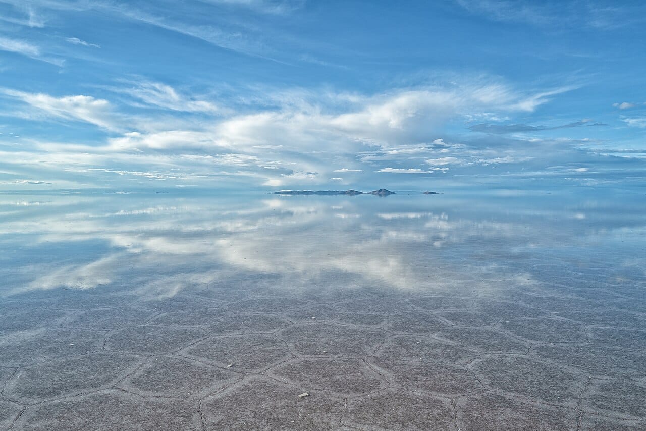 The Salar de Uyuni, the largest salt flat on Earth, a dazzling white expanse on the Bolivian Altiplano. Beneath its crust lie some of the world's greatest reserves of lithium, the metal at the heart of the modern battery.