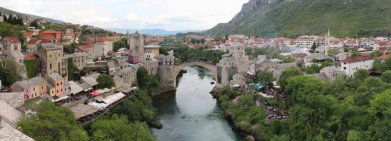 The Old Bridge of Mostar, an Ottoman masterpiece that arched over the Neretva for more than four centuries. Deliberately destroyed during the war in 1993 and rebuilt in 2004, it has become the symbol of both Bosnia's suffering and its hope of reconciliation.
