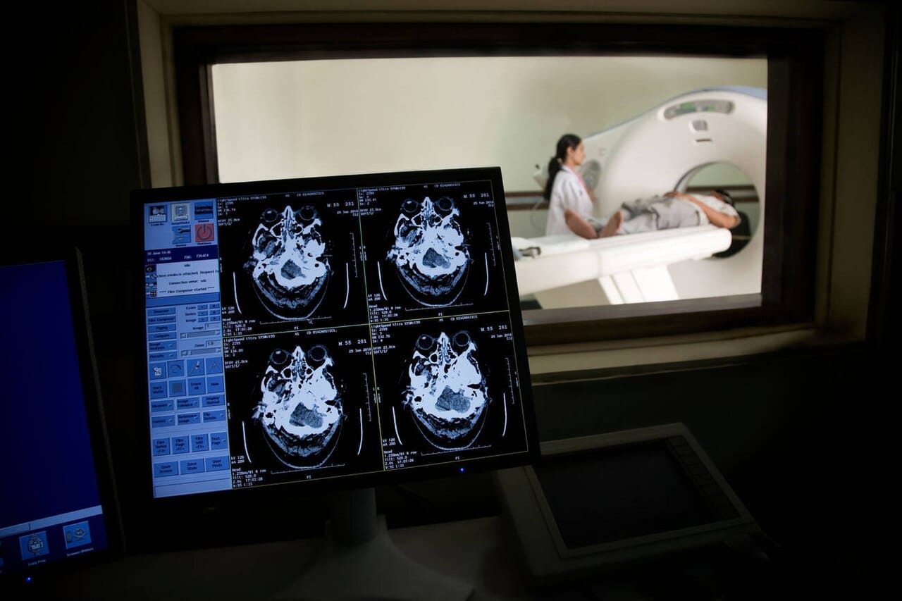 A computed tomography scan. X-rays taken from many angles are combined into cross-sections, which is fast and widely available and delivers ionising radiation.