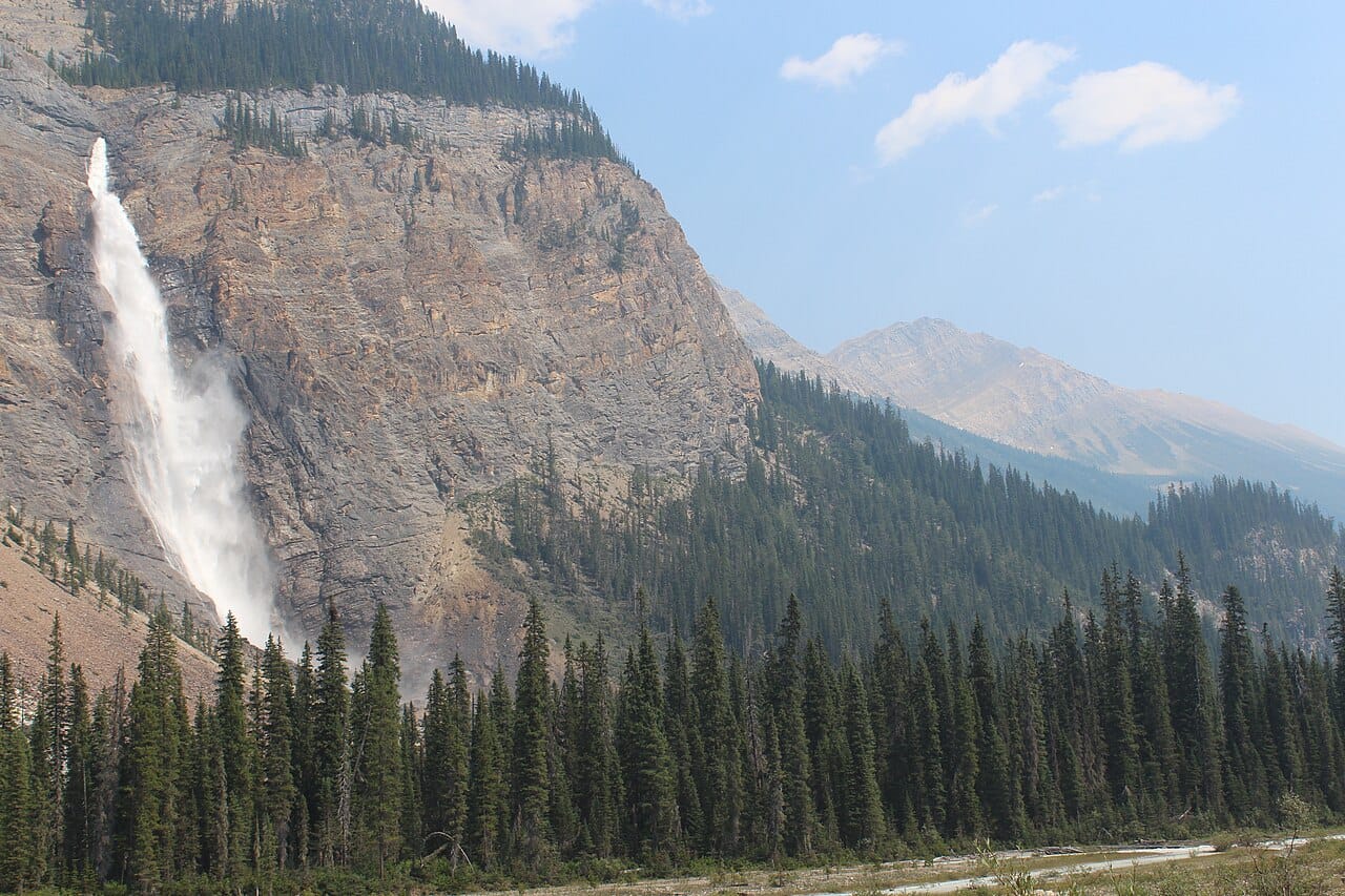 Takakkaw Falls in Yoho National Park, among the highest waterfalls in Canada, fed by a mountain glacier. Meltwater from the peaks feeds the province's great rivers.