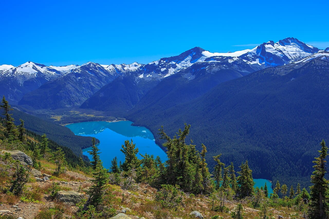 A hiker on a high trail above Whistler, one of the world's leading ski and mountain resorts. British Columbia's mountains, forests, and coast underpin a famous culture of outdoor life.
