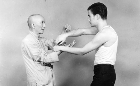 Bruce Lee with his teacher Ip Man, the renowned Wing Chun master, in 1958.
