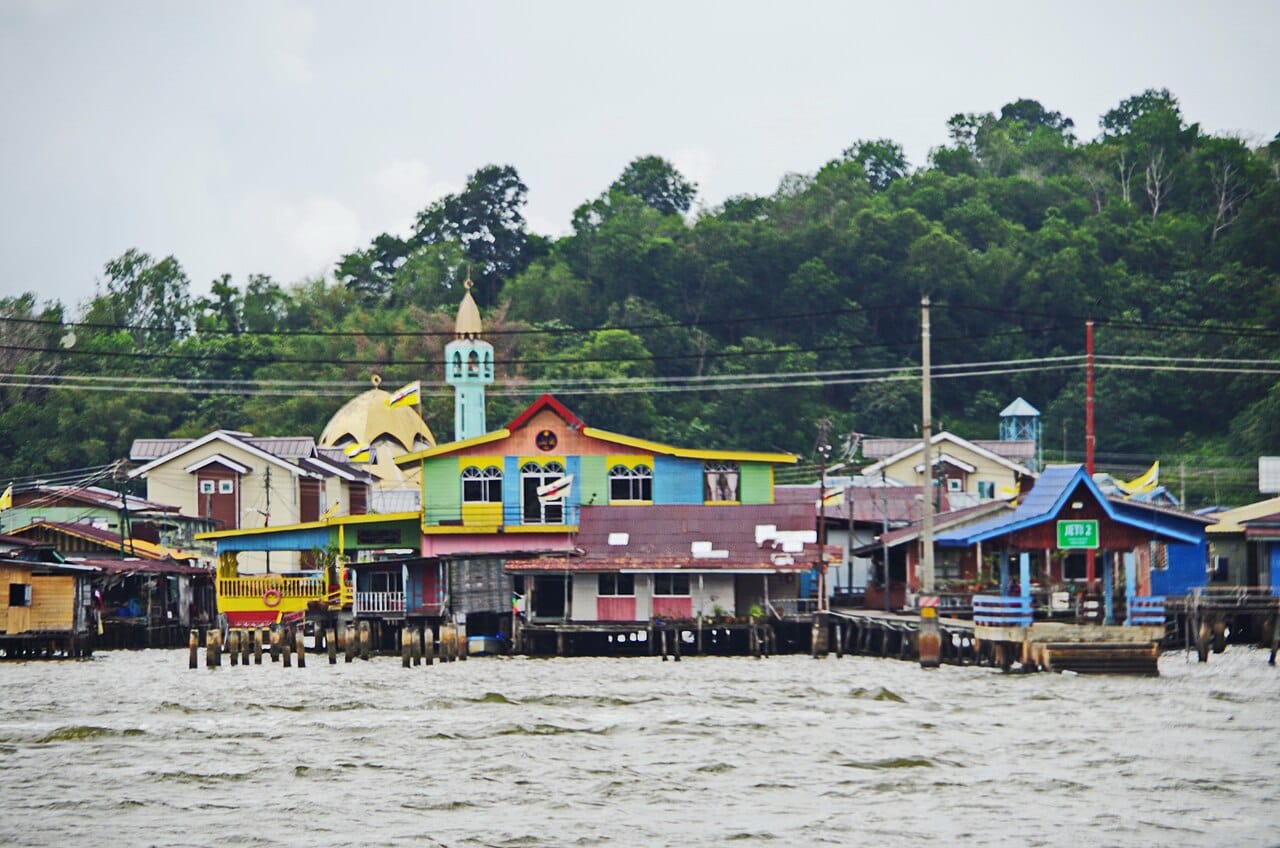 Kampong Ayer, the historic water village of stilt houses on the Brunei River in the heart of the capital. Home to a large part of the city's population for centuries, it endures beside the wealth of the modern oil state.
