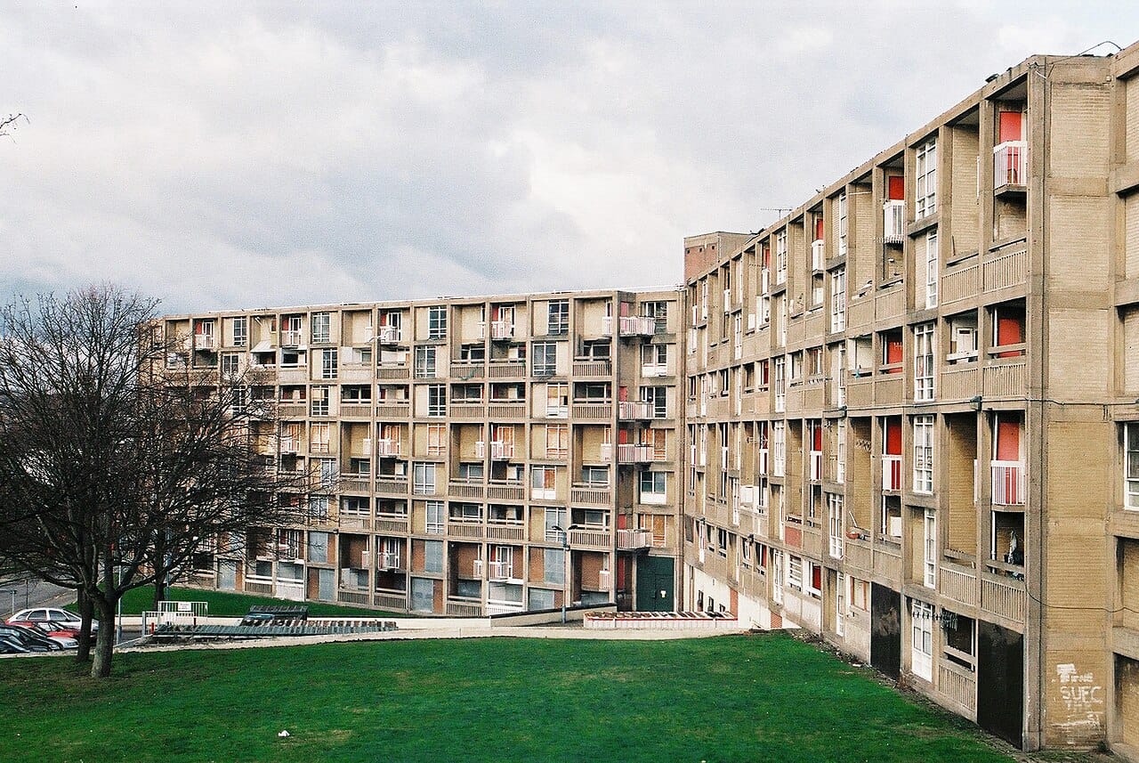 Park Hill in Sheffield, completed in 1961, with its streets in the sky intended to reproduce terraced-street sociability in a high-rise block. It fell into severe decline and was later listed and refurbished.