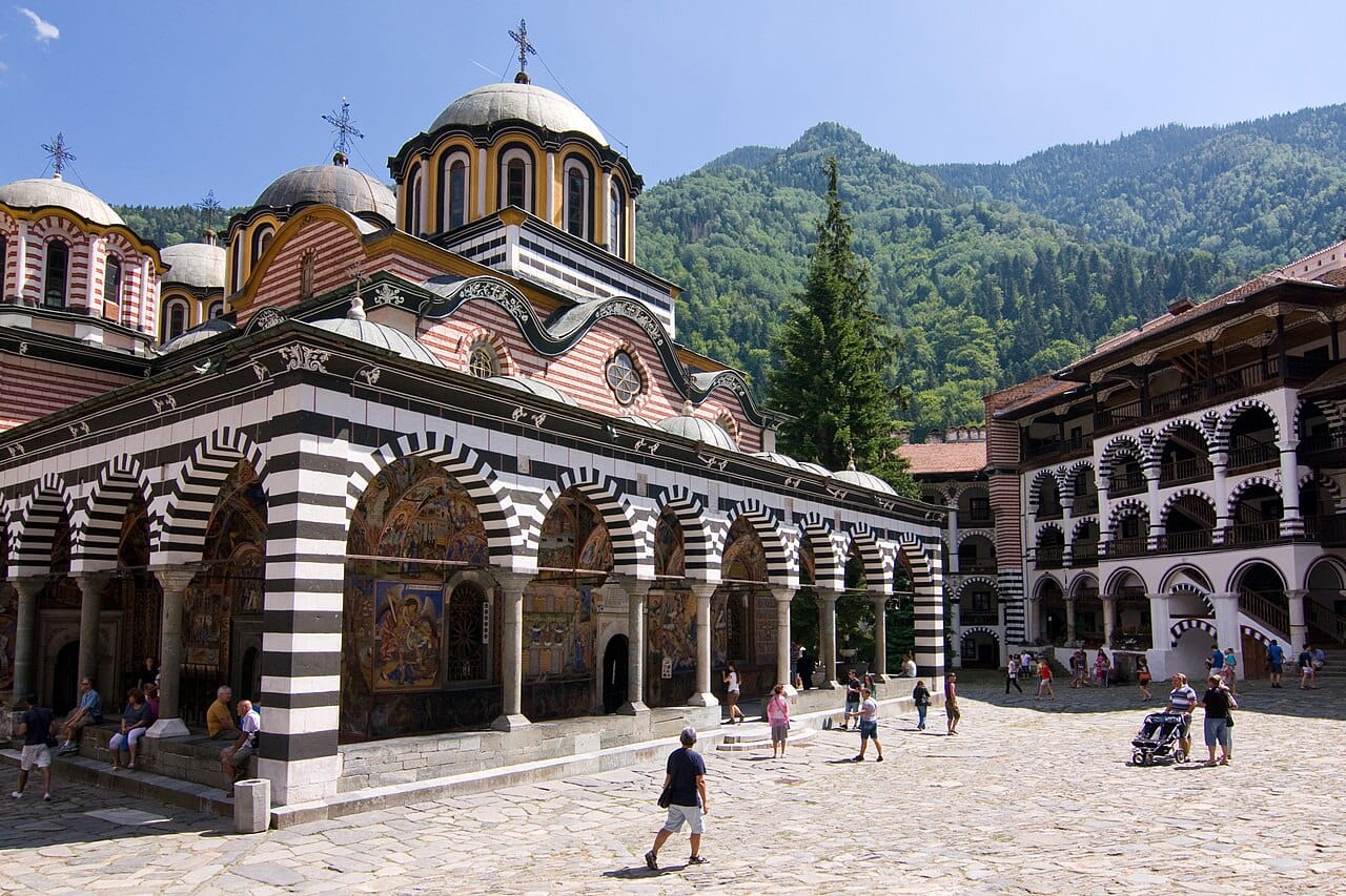 The Rila Monastery, nestled high in the mountains of southwestern Bulgaria. Founded in the tenth century and rebuilt over the ages, this World Heritage site is the largest and most revered monastery in the country, a stronghold of Bulgarian faith and identity.