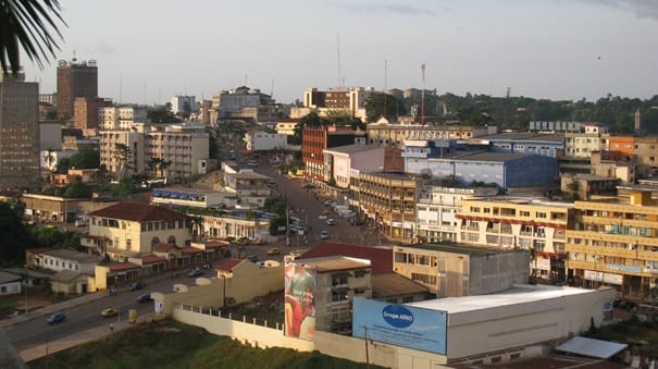 The city of Yaounde, the capital of Cameroon, set among the green hills of the interior. Together with the larger coastal port of Douala, it anchors a young and fast-growing nation of remarkable ethnic and linguistic diversity.