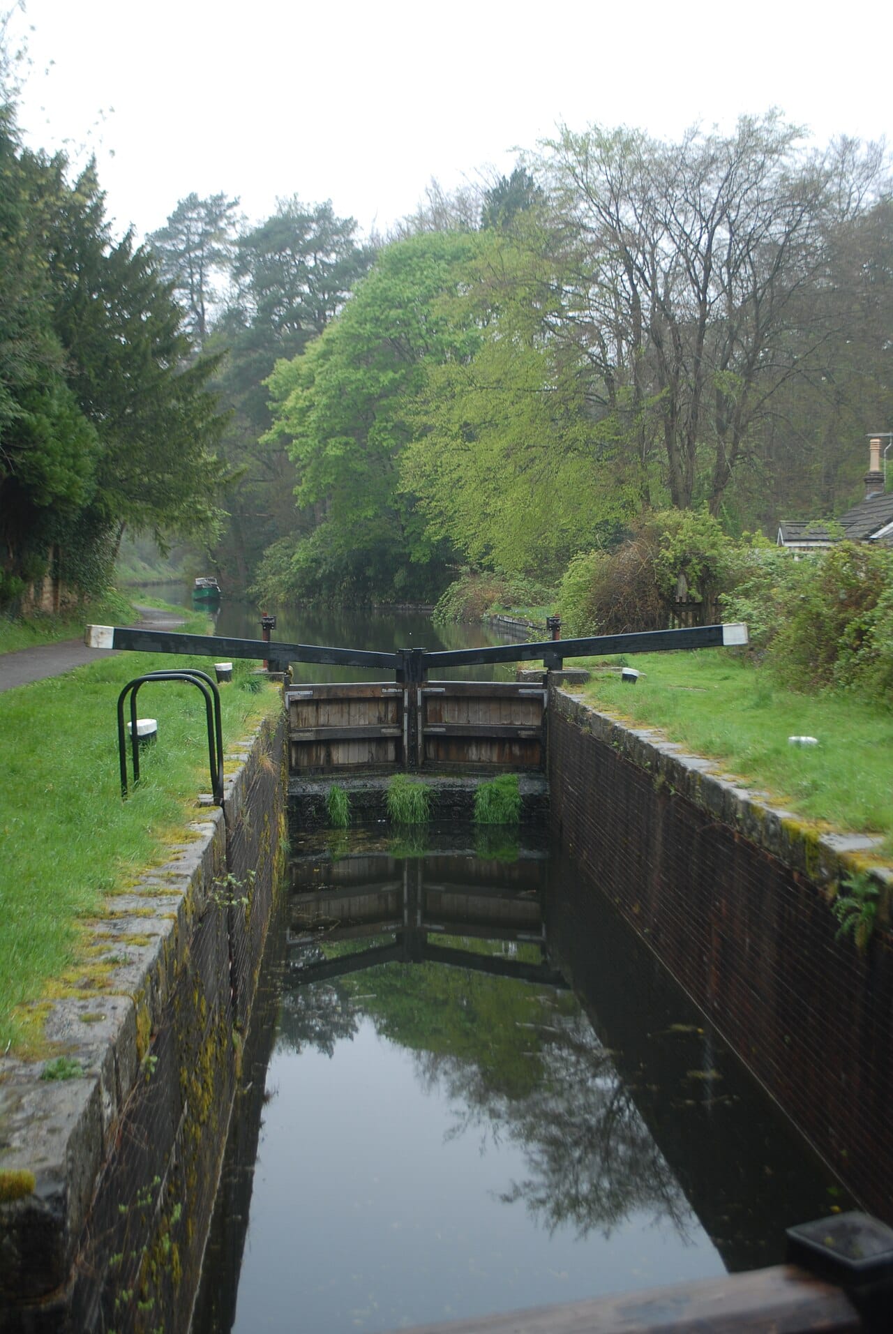 A canal lock. Raising a boat between levels by enclosing it in a chamber and changing the water level is the invention that made canals possible across varied terrain.