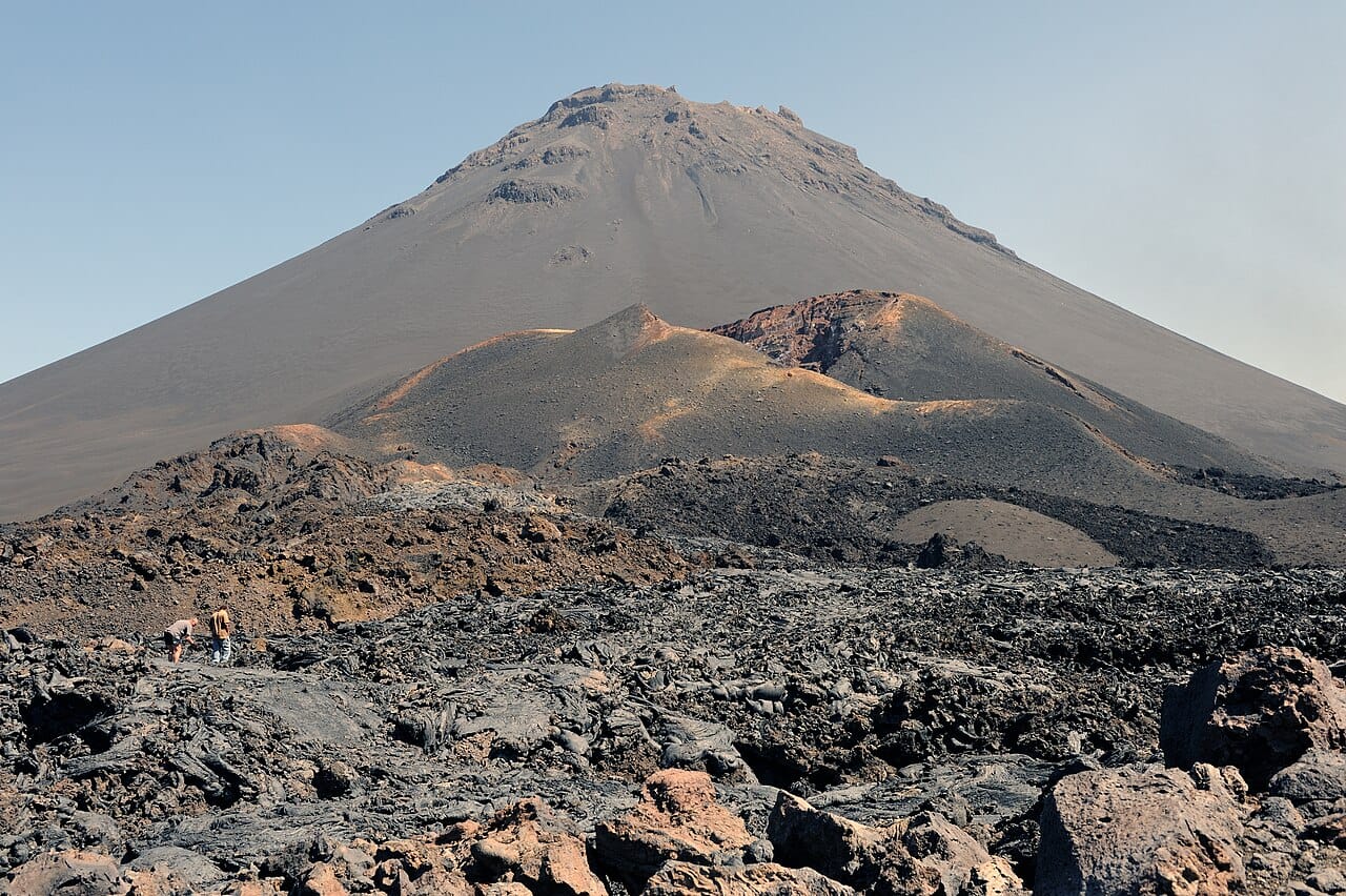Pico do Fogo, the active volcano on the island of Fogo and the highest point of Cabo Verde. Its slopes, farmed for coffee and wine, and its lava fields are among the dramatic volcanic scenery of the dry archipelago.
