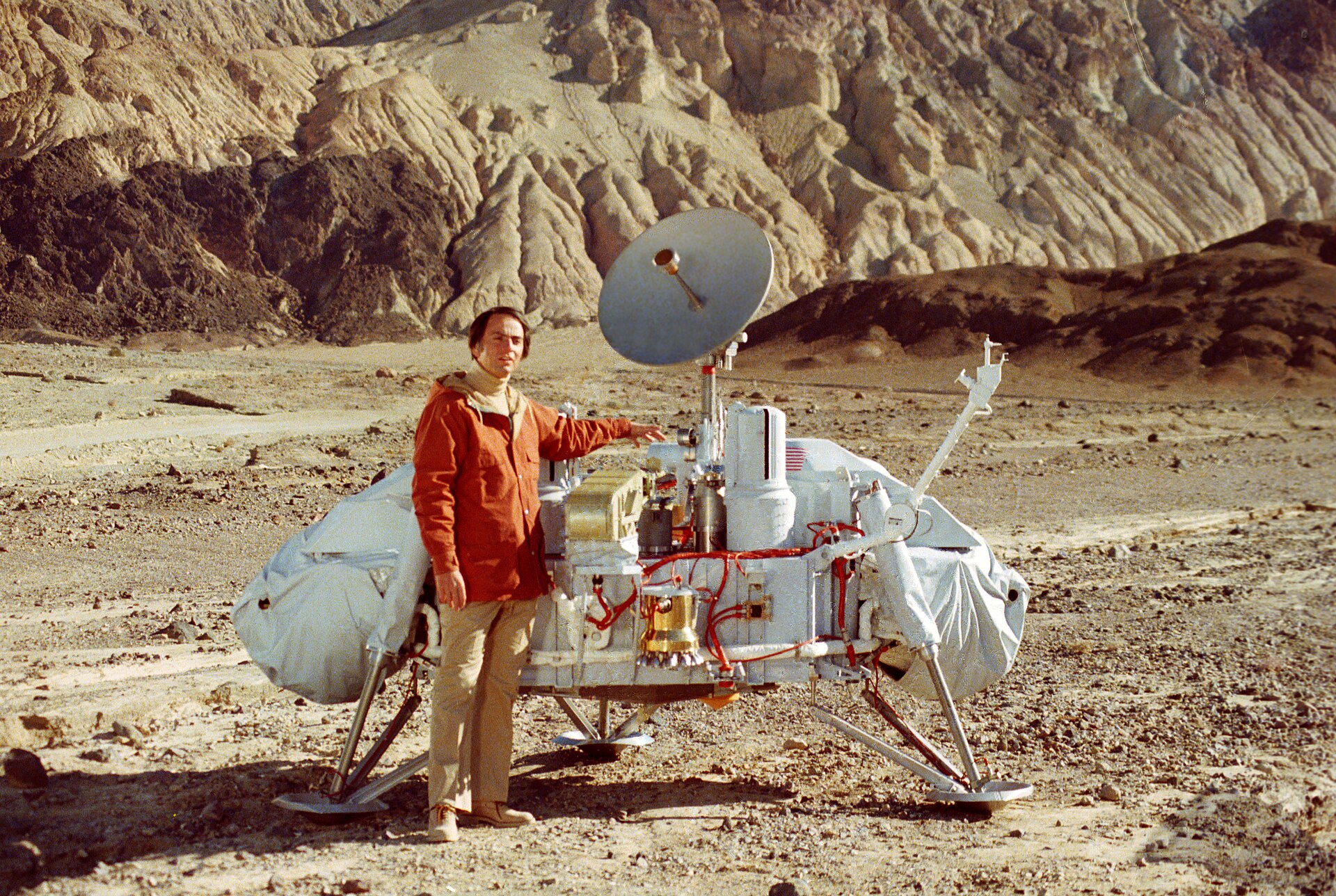 Carl Sagan beside a model of the Viking lander, which he helped send to Mars.