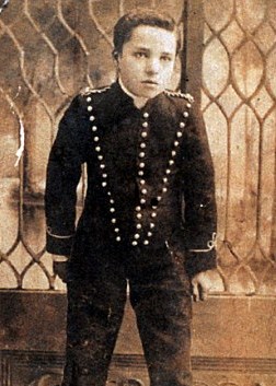A teenage Chaplin performing on stage, long before his film fame.