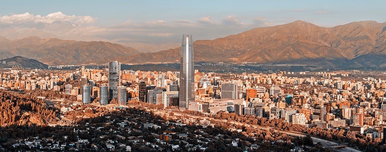 Santiago, the capital of Chile, spread across its basin beneath the snow-capped Andes. Home to a large share of the nation's people, it is the political, financial, and cultural heart of one of Latin America's most prosperous countries.