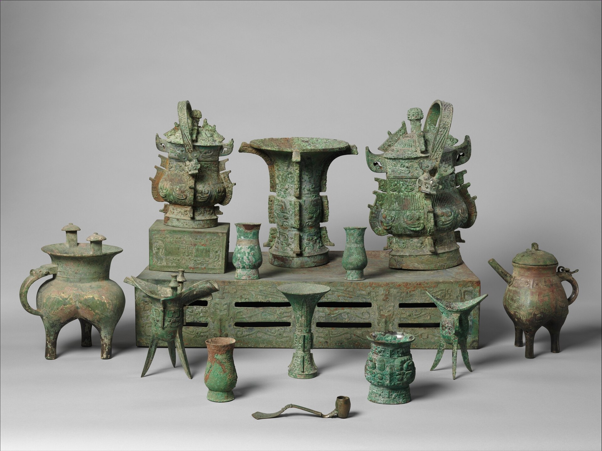Western Zhou ritual bronzes, cast around 1000 BC. Vessels like these were used in ancestor worship and carry some of the earliest Chinese inscriptions, from the dynasty that also produced Confucius.