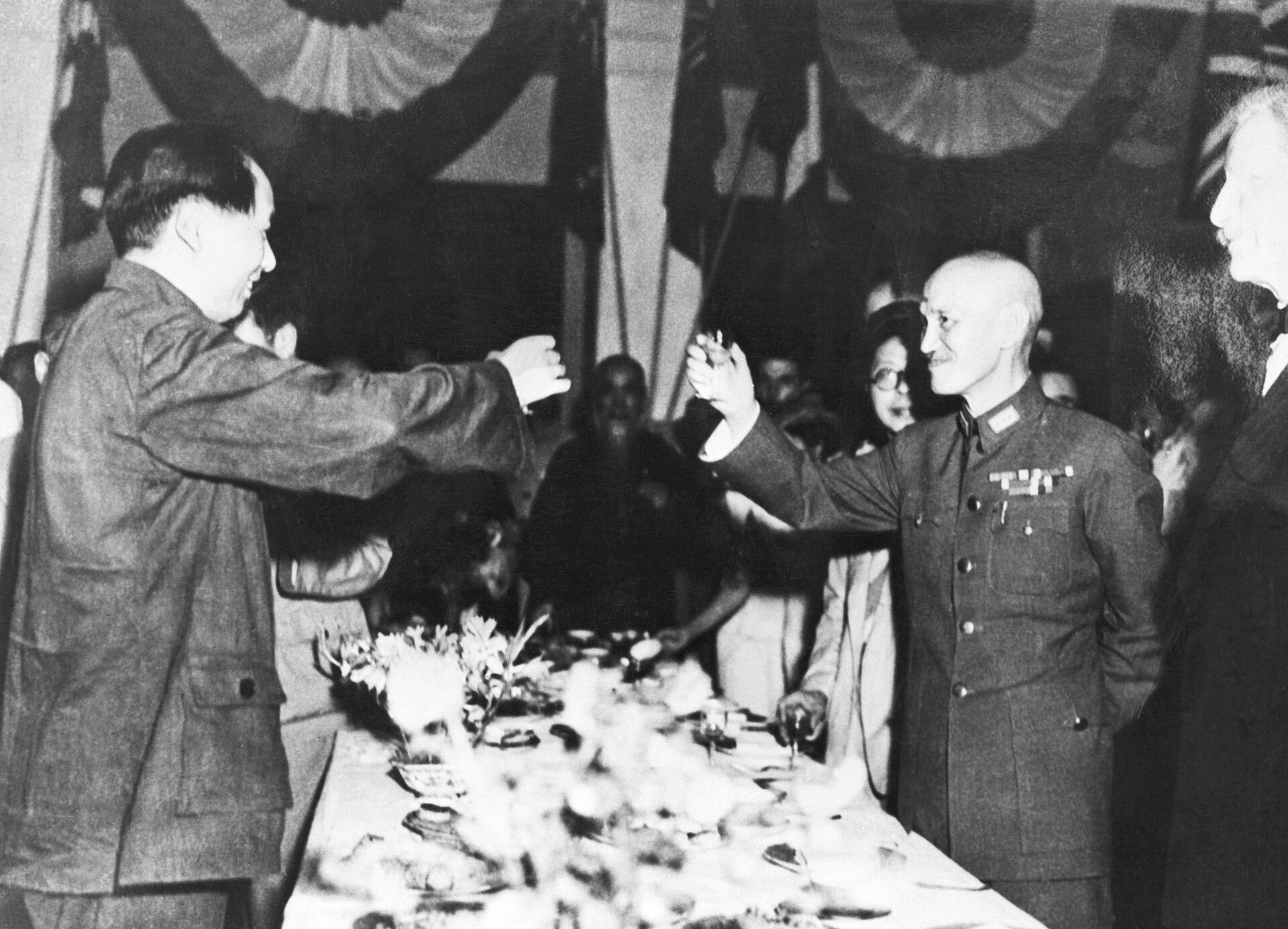 Mao Zedong and Chiang Kai-shek in 1945, shortly before the civil war that brought the Communists to power. Credit: Unknown authorUnknown author (Public domain).