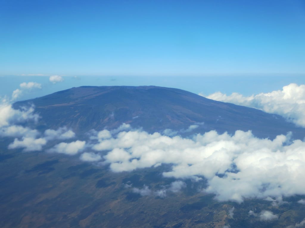 Mount Karthala, the active volcano that dominates Grande Comore, the largest island. One of the largest active volcanoes in the world, it gives the island the fragrant volcanic soils on which the country's perfume crops are grown.