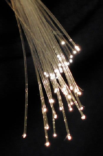 Optical fibre. The physical layer carries bits and is entirely separate from the layers that give them meaning, which is what allows the medium to change without affecting anything above it.