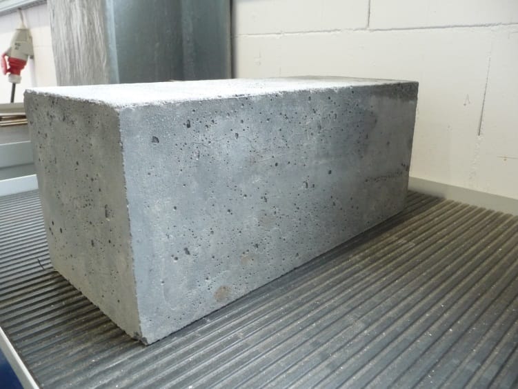 A concrete block. Cement is the binder and the sand and stone are the bulk of the material, which is why concrete is far cheaper than cement alone.