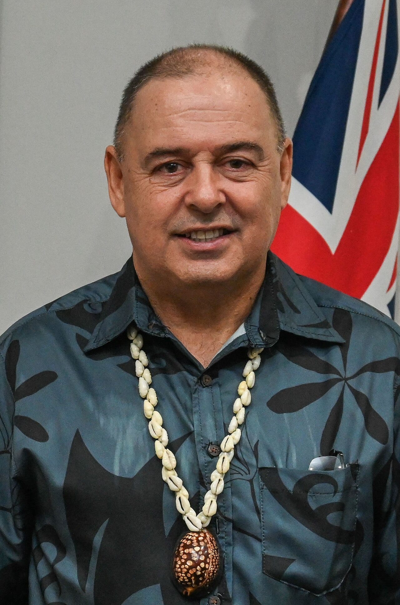 Mark Brown, prime minister since 2020. His 2025 partnership agreement with China led New Zealand to pause development funding, a dispute settled by a defence and security pact in April 2026.