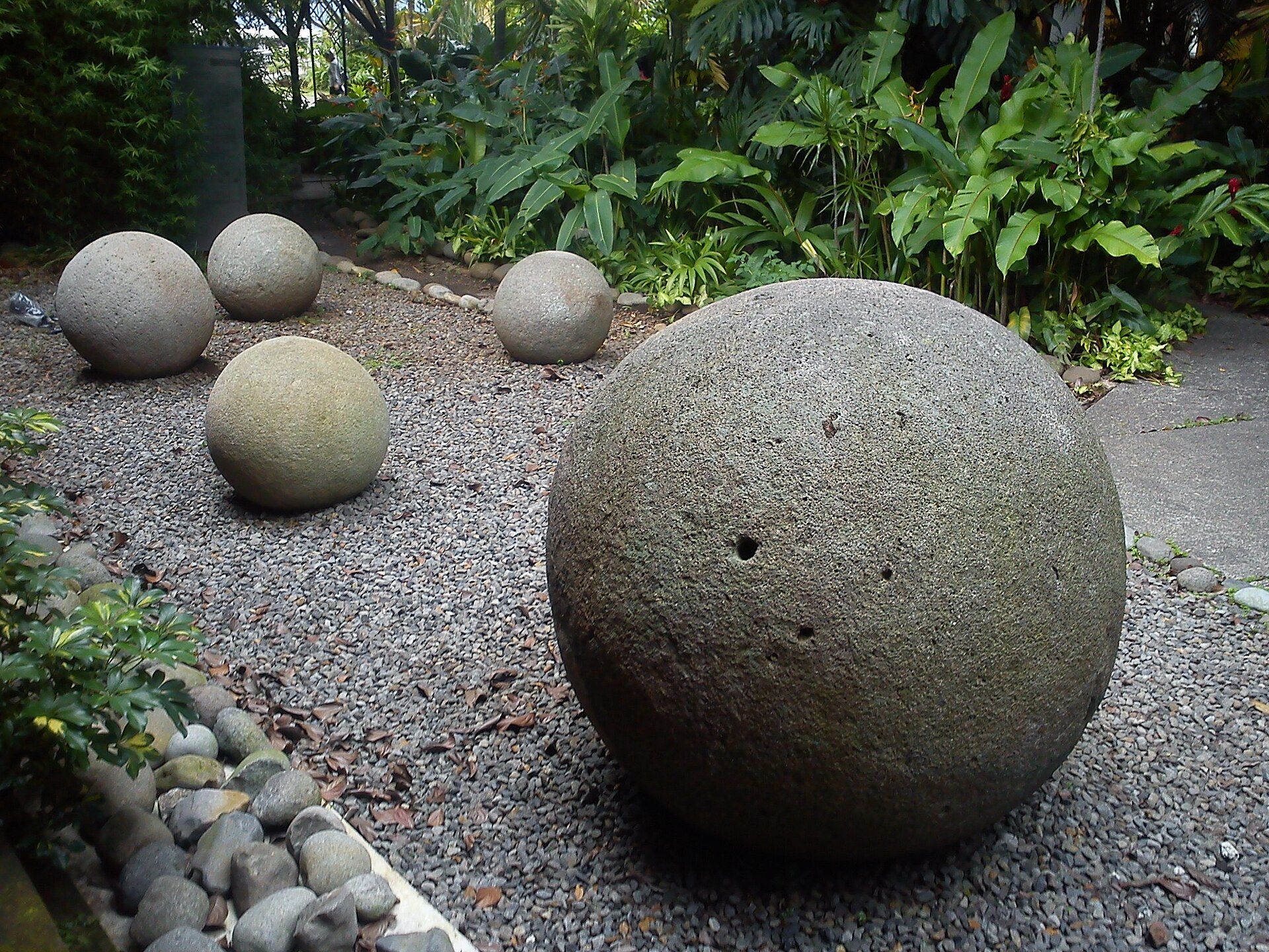Pre-Columbian stone spheres of the Diquis culture, some nearly perfectly round and over two metres across. Carved with remarkable precision, their purpose remains one of the genuine unsolved mysteries of ancient Central America.