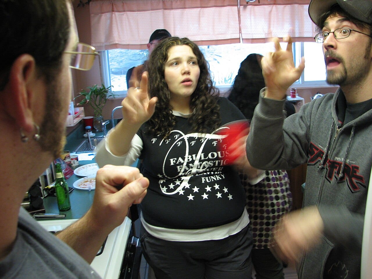 A family using American Sign Language. Deaf children given accessible language from infancy acquire it on a normal timetable, while those whose access is delayed show lasting grammatical deficits.