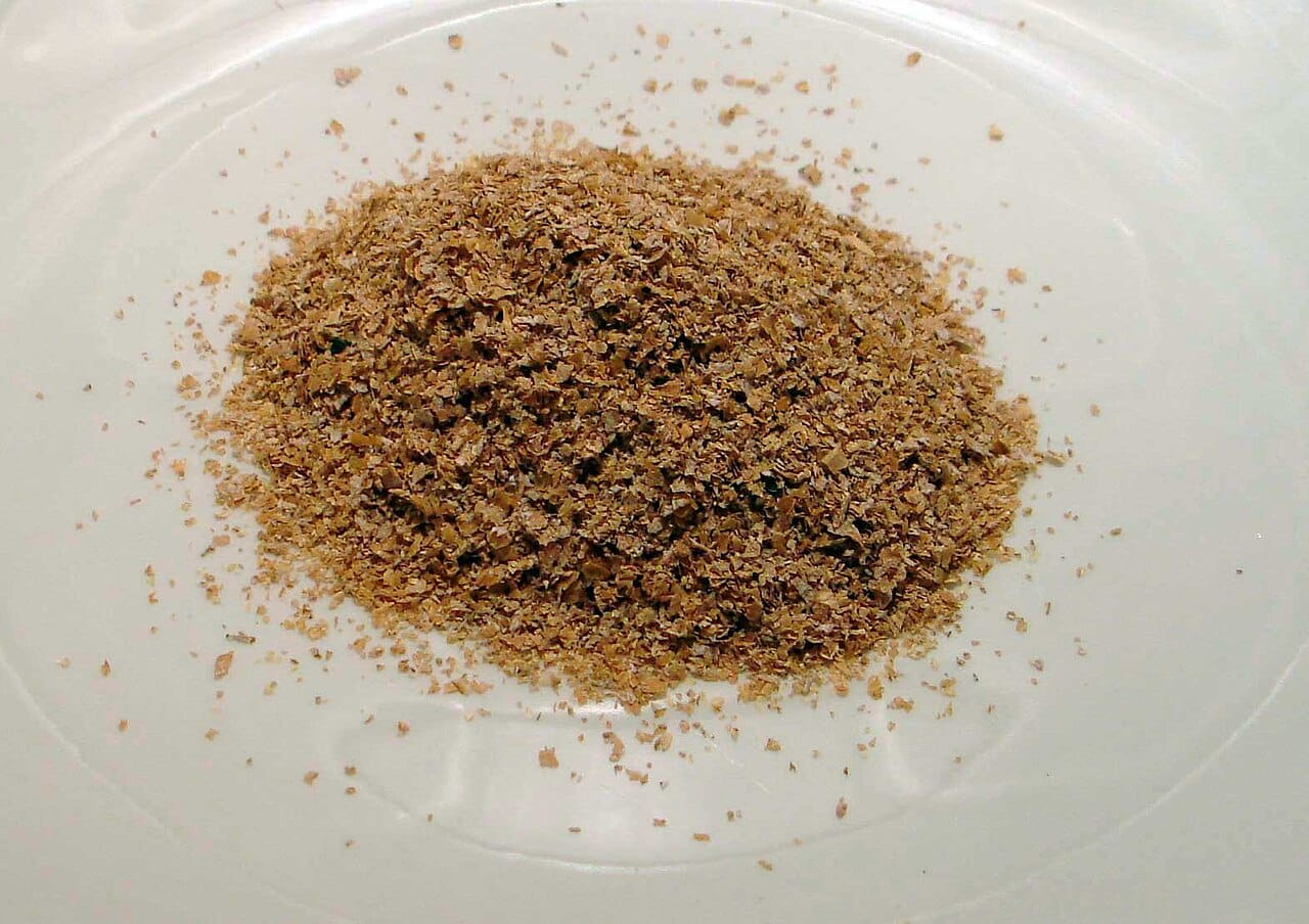 Wheat bran. Milling removes the outer layers of the grain, which is where most of the fibre is, and this is the difference between whole and refined grain products.