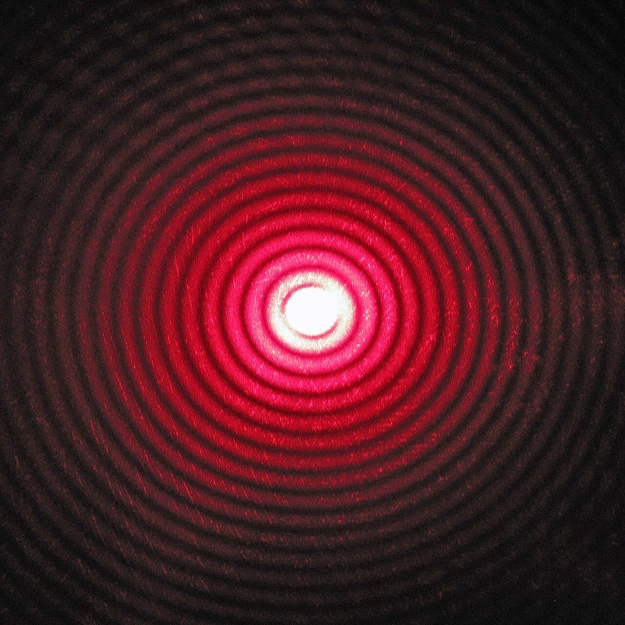 The Airy pattern produced by a circular aperture: a bright central disc surrounded by faint rings. Every point source imaged by any lens or mirror becomes a disc of this kind.