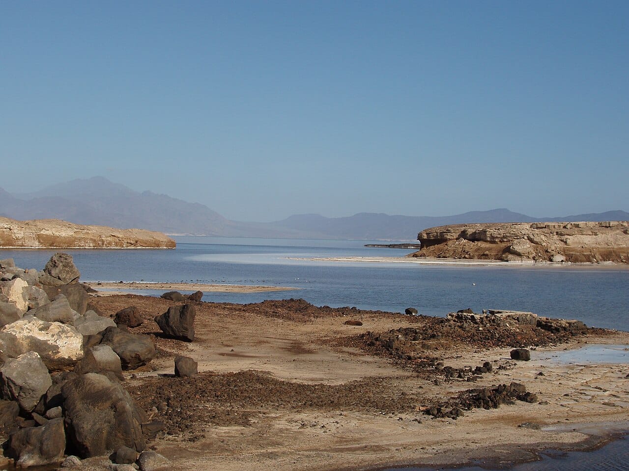 Lake Assal, 155 metres below sea level, the lowest point in Africa and among the saltiest bodies of water in the world. Its salt pans have been worked by caravan for centuries.