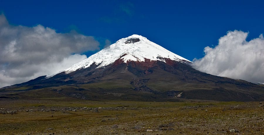 The perfect snow-capped cone of Cotopaxi, one of the highest active volcanoes in the world, in the Ecuadorian Andes. A chain of such volcanoes runs down the highland spine of the country, which straddles the equator.