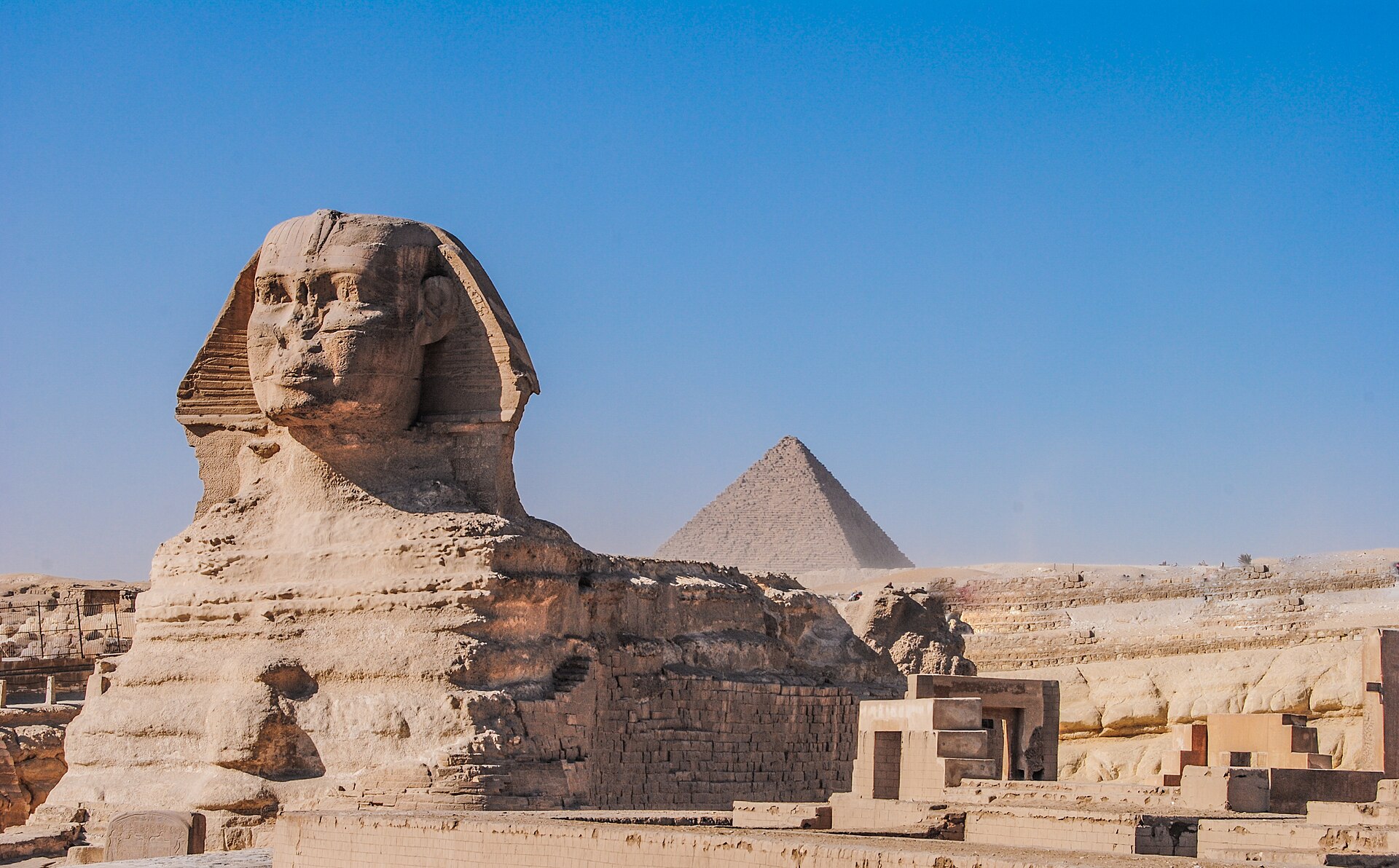 The Great Sphinx of Giza, carved from bedrock around 2500 BC. The colossal lion with a human head has guarded the pyramids for some four and a half thousand years.