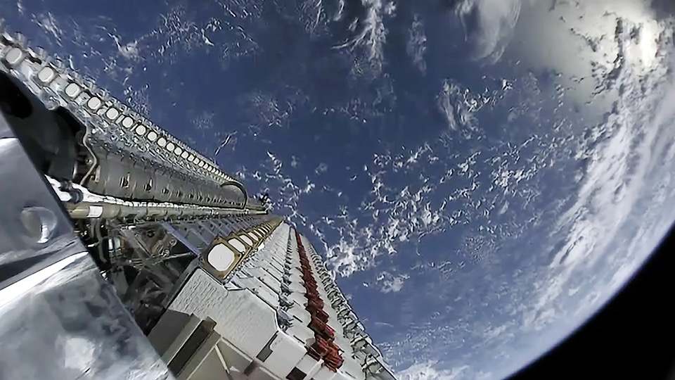 Fifty Starlink satellites stacked before deployment to low Earth orbit.
