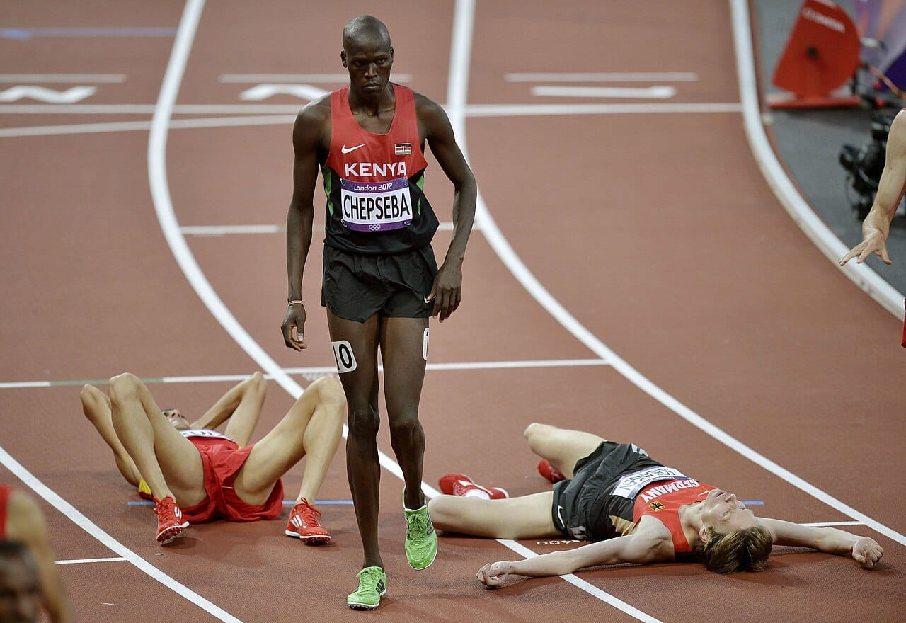 A long-distance runner. Over sufficient distance and in heat, human endurance exceeds that of most quadrupeds, which is the observation the hypothesis is built on.