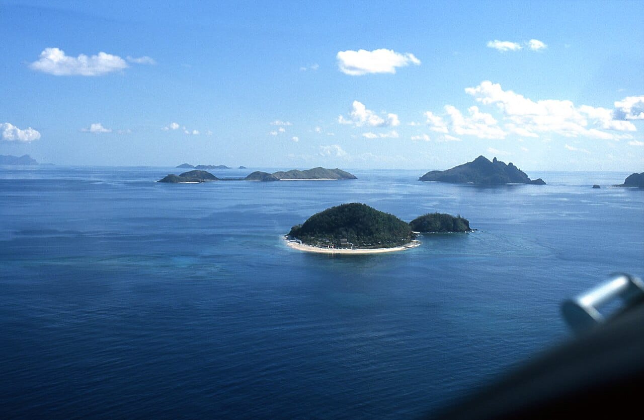 Small islands of the Mamanuca group off Viti Levu, ringed by coral reefs and turquoise lagoons. Scenery like this has made Fiji the most visited nation in the South Pacific and given tourism a central place in its economy.