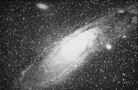 An early photograph of the Andromeda nebula. Before distances could be measured, whether such objects lay within the Milky Way or far outside it could not be settled.