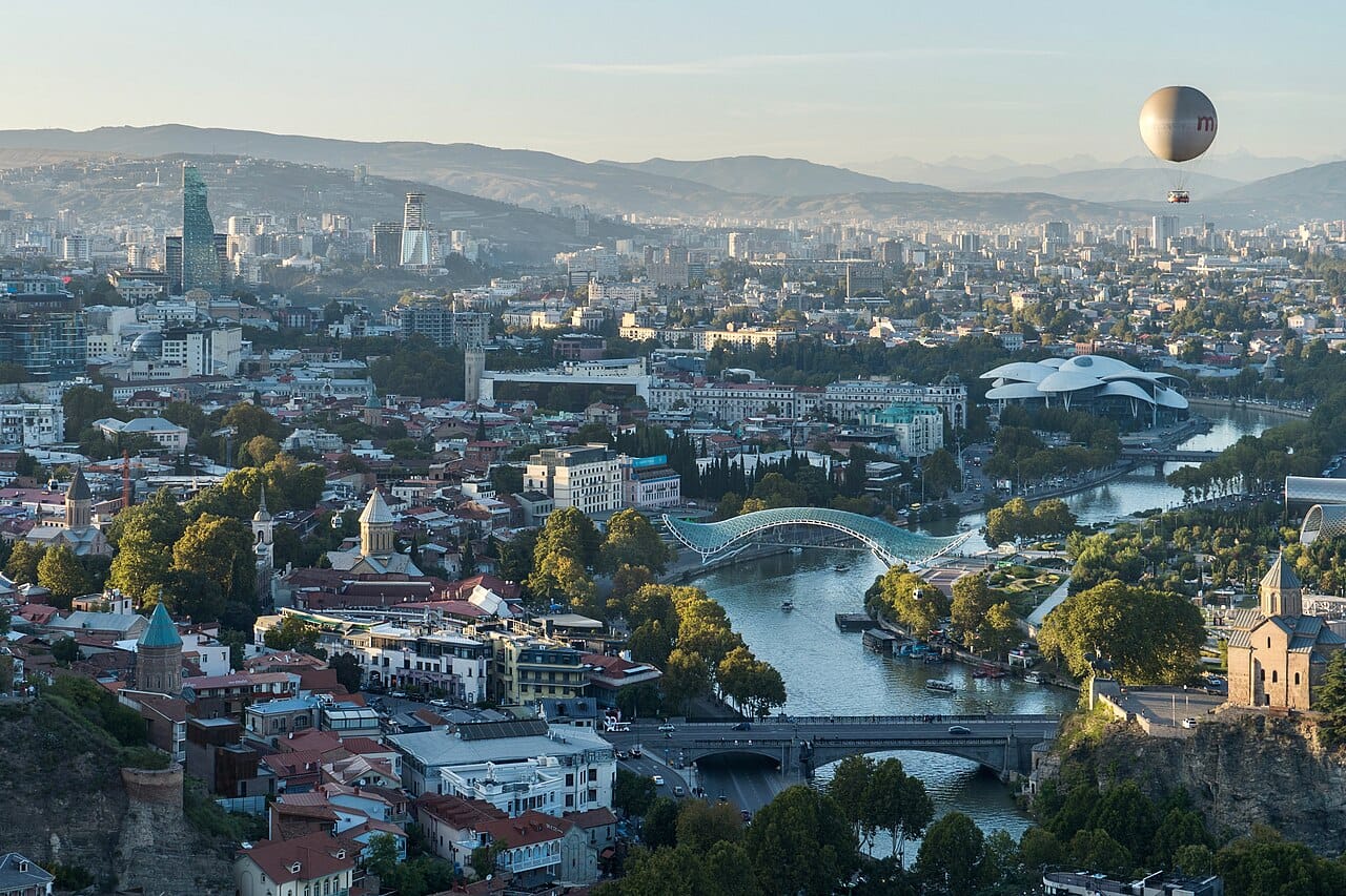 Tbilisi, the capital and largest city of Georgia, spread along the valley of the Kura river. Founded in the fifth century around its warm sulphur springs, it blends ancient churches and old balconied houses with modern building and is the centre of national life.