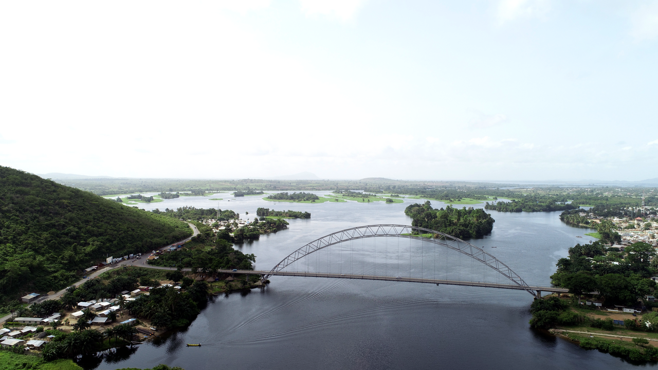 The Adomi Bridge over the Volta River. The damming of the Volta at Akosombo in the 1960s was Nkrumah's flagship project: it created one of the world's largest artificial lakes, supplied the electricity for an aluminium industry, and displaced tens of thousands of people.